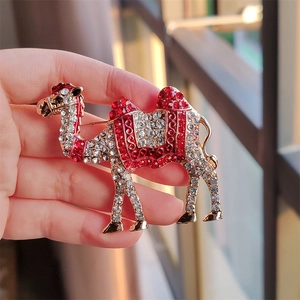 Creative vintage camel brooch pin with red and white crystals in gold finish