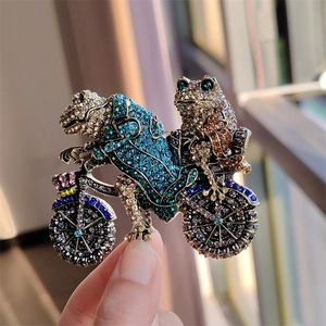Vintage style frog riding a bicycle brooch with colorful crystal rhinestones