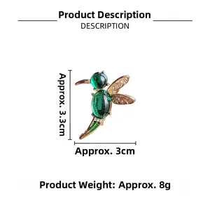 Detailed view of hummingbird brooch size 3.3cm x 3cm with opal and gold wings