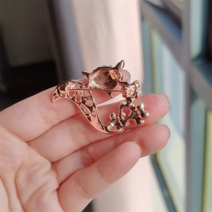 Detail of rose gold fox brooch back with secure pin clasp and hollow design