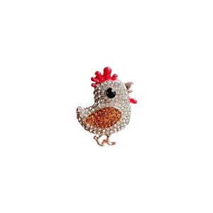 Élégante broche poussin avec cristaux blancs et ambre étincelants sur base en alliage doré