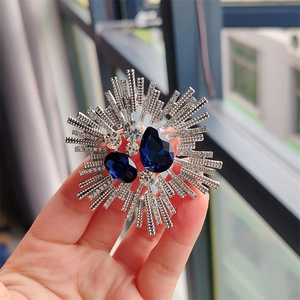 Vintage silver crystal brooch with dual dark blue teardrop stones and zircon accents