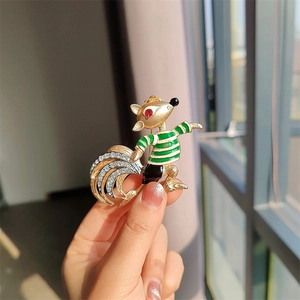 Vintage squirrel brooch in gold plating with green enamel stripes and white zircons