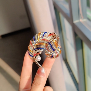 Vintage golden feather brooch with colorful enamel, rhinestones and shell pearl