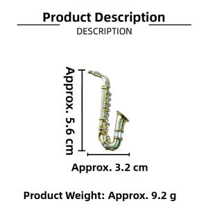 Detail view of gold saxophone brooch with sparkling rhinestones and size dimensions