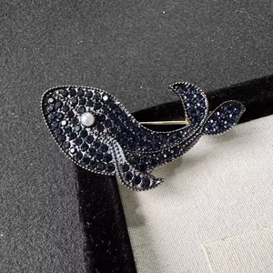 Vintage luxury blue whale brooch with sparkling crystals and pearl detail for coats