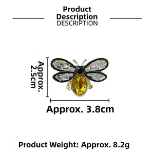 Detailed macro view of bee brooch with zircon wings and yellow gem, 3.8cm x 2.5cm size