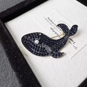 Blue whale brooch with navy blue crystals and white pearl on elegant vintage backing