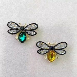 Vintage bee brooches with yellow and green crystals on gold-toned metal plating