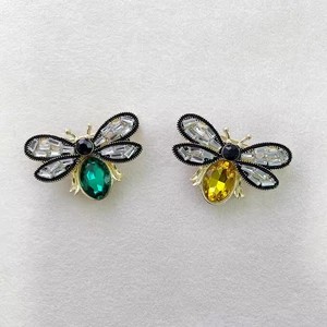 Vintage gold bee brooch set with emerald green and bright yellow zircon crystals
