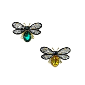 Vintage gold bee brooches with emerald green and amber yellow stones and zircons