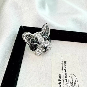 French Bulldog head brooch with white and black crystals on a silver metal base
