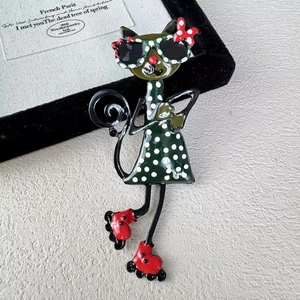 Retro spotted cat brooch with roller skates and sunglasses on black velvet