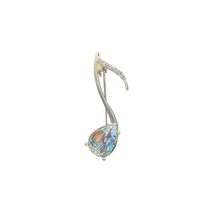 Broche élégante en forme de note musicale en métal argenté avec gemme irisée et zircons