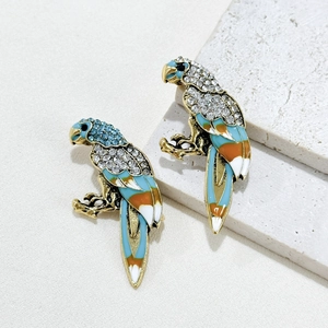 Vintage parrot brooch with colorful enamel wings and sparkling rhinestones on gold base