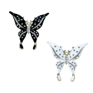 Elegant butterfly brooch set with rhinestones and enamel in black and white finish