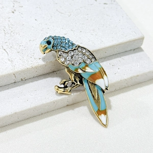 Elegant gold parrot brooch with blue rhinestones and colorful enamel feathers