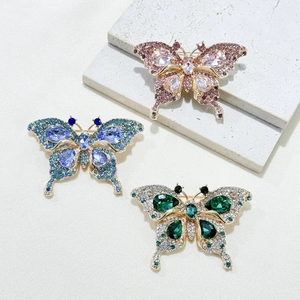 Elegant crystal butterfly brooches in pink, blue and green with gold alloy plating