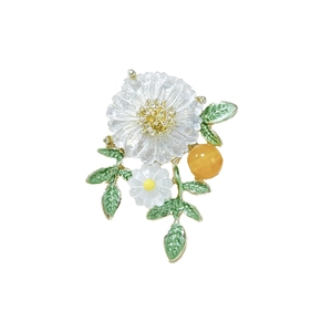 Elegant white daisy floral brooch with green enamel leaves and yellow bead on gold plating