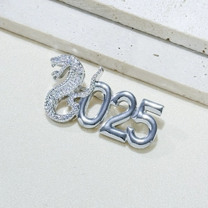 Detail view of silver 2025 snake brooch with sparkling rhinestones and mirror finish