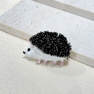 Cute hedgehog brooch with white enamel body and black micro-bead details for women