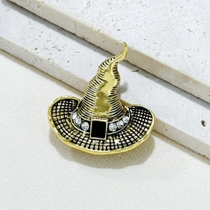 Golden vintage witch hat brooch with sparkling rhinestones and black enamel detail