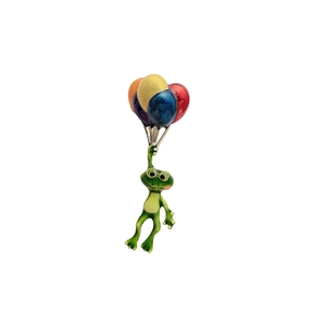 Détail macro du pin's émaillé grenouille de dessin animé tenant des ballons colorés