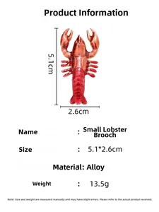 Detailed view of red lobster brooch with dimensions 5.1cm by 2.6cm and alloy material