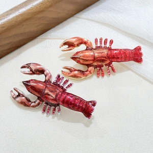 Exquisite lobster brooch set in bright and deep red enamel with sparkling rhinestones