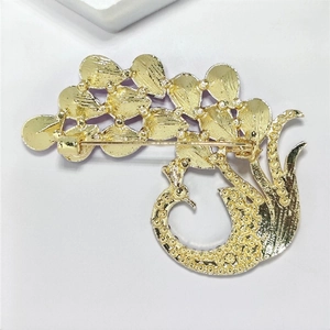 Elegant purple peacock brooch in gold-plated alloy with secure back pin fastener