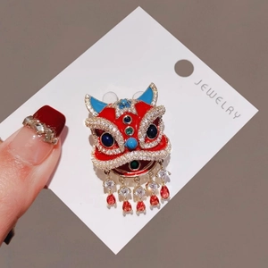 Traditional Chinese red lion dance brooch with vibrant enamel and sparkling zircon tassels