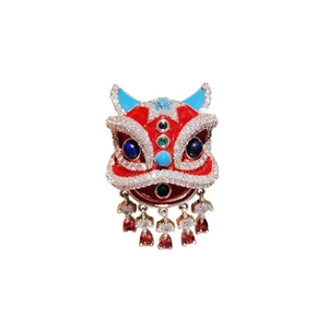 Macro shot of red enamel Lion Dance brooch with crystal tassels and vibrant gemstones