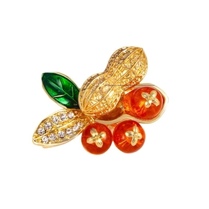 Peanut and berry brooch with gold metal base, green enamel leaves and red resin berries