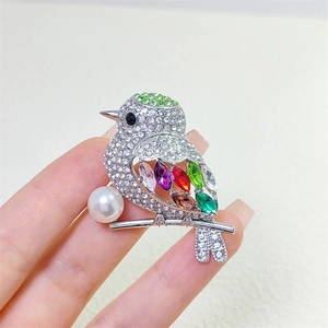 Elegant bird brooch with colorful marquise stones and pearl on silver base for women