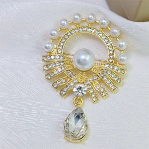 Elegant gold vintage pearl and rhinestone brooch with teardrop crystal for luxury style