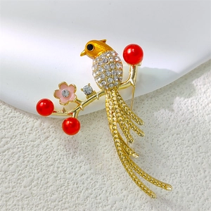 Exquisite gold magpie bird brooch with sparkling rhinestones and red berry accents