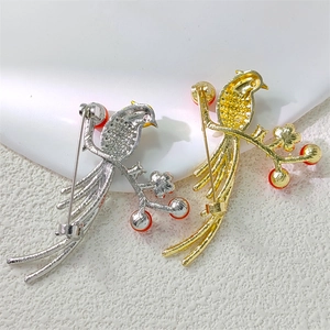 Detailed back view of vintage magpie brooches with safety pin and rotating clasp