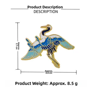 Detail shot of crane enamel brooch with size dimensions 3.7cm x 4.8cm and weight 8.5g