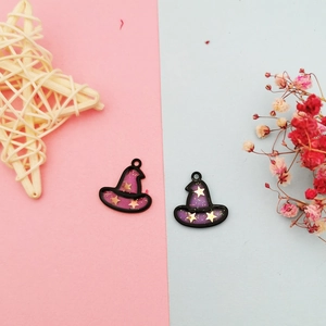 Detail of purple cartoon wizard hat pendants with gold stars for DIY jewelry