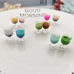 Miniature colorful bubble tea cup models for dollhouse decor and DIY crafts on a white plate