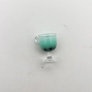Miniature clear goblet with green tea and pearls for DIY dollhouse crafts