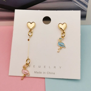 Asymmetric heart earrings with blue and pink flamingo charms in golden finish