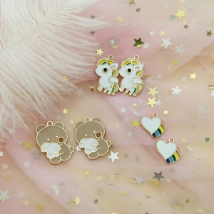 DIY enamel jewelry charms set with colorful unicorns, bears and rainbow hearts