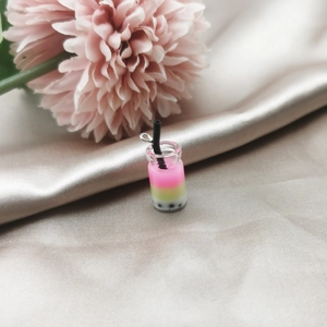 Detailed macro view of 3-layer gradient resin bubble tea charms for DIY earring crafts