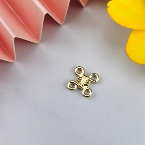 Detailed view of gold metal garment fastener hook and eye closures for sewing crafts