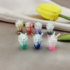 Detailed view of colorful mini resin ice cream pendants with cream and stir sticks