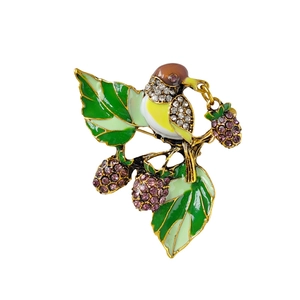 Vintage bird and strawberry brooch with enamel leaves and sparkling purple crystals