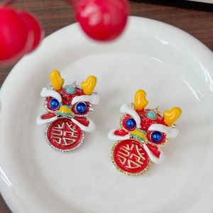 Traditional Chinese red dancing lion earrings with festive gold and blue enamel details