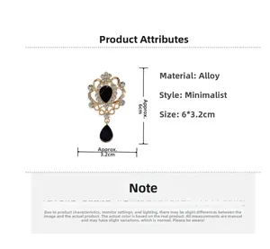 Macro detail of a vintage gold brooch with sparkling crystals and black teardrop stones
