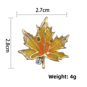 Detail of vintage maple leaf brooch showing dimensions 2.8cm by 2.7cm and 4g weight